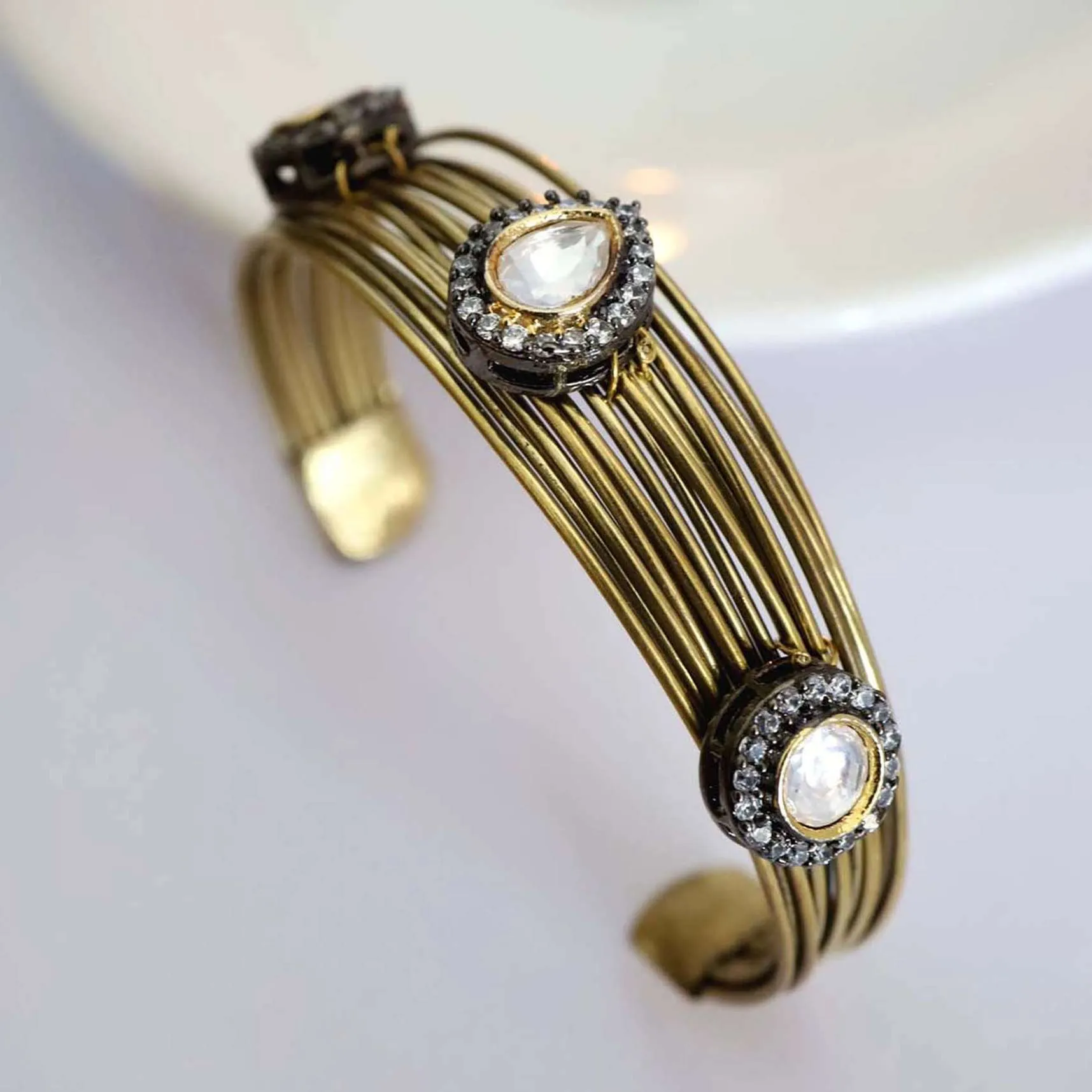 Gold Plated Bracelet With In An Edgy Style With Kundan Polki Work